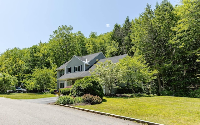 81 Summit Ridge Dr, Keene, NH 03431 - view of front of house with a front lawn and a forest view
