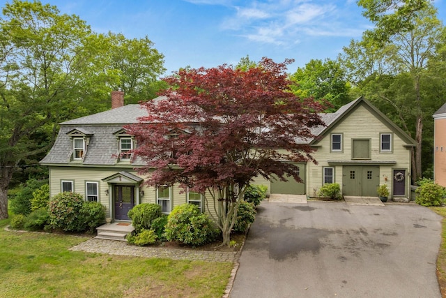 223 Atlantic Ave, North Hampton, NH 03862 - view of front of property with a chimney, roof with shingles, and a front yard