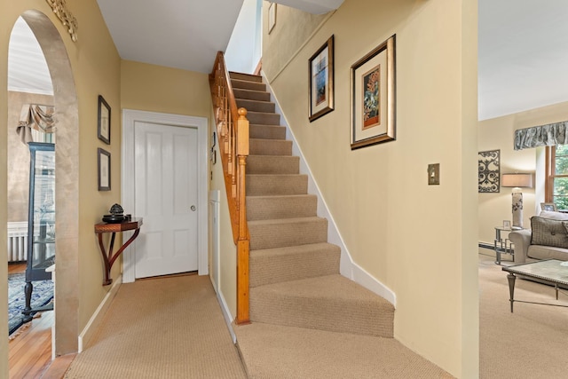 223 Atlantic Ave, North Hampton, NH 03862 - stairs with carpet floors and arched walkways