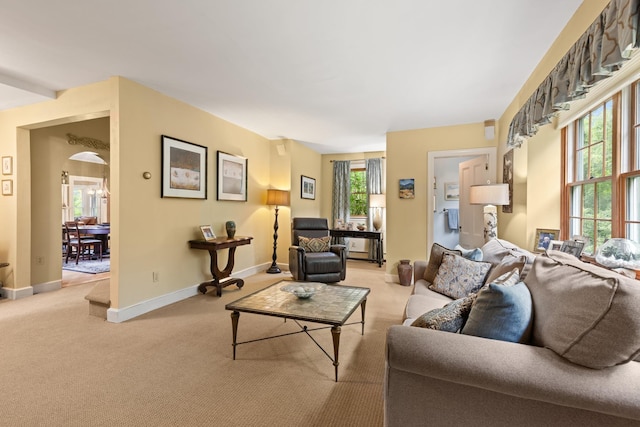 223 Atlantic Ave, North Hampton, NH 03862 - living room featuring light carpet and arched walkways