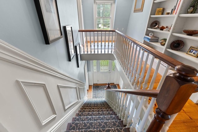 223 Atlantic Ave, North Hampton, NH 03862 - stairs with plenty of natural light, wood finished floors, and built in shelves