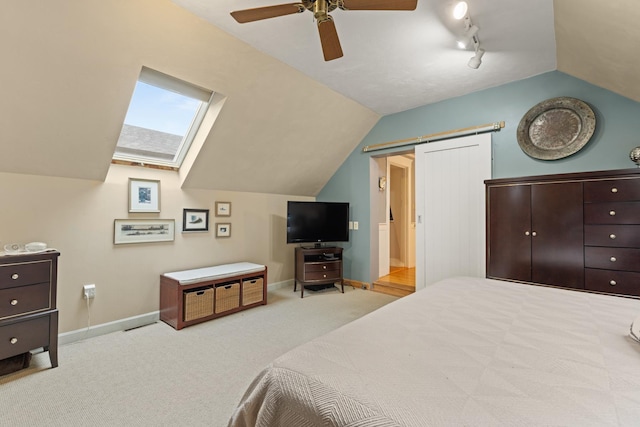 223 Atlantic Ave, North Hampton, NH 03862 - carpeted bedroom featuring lofted ceiling, a ceiling fan, and a barn door