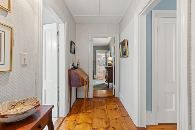223 Atlantic Ave, North Hampton, NH 03862 - hall featuring light wood finished floors, crown molding, and wallpapered walls