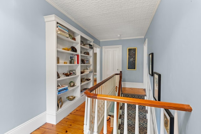 223 Atlantic Ave, North Hampton, NH 03862 - hall with an upstairs landing, light wood-style flooring, and crown molding