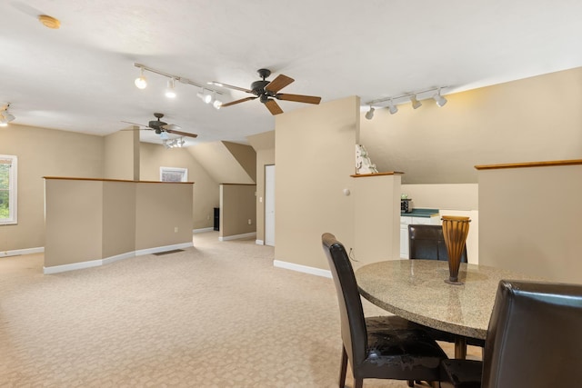 223 Atlantic Ave, North Hampton, NH 03862 - dining area featuring track lighting, a ceiling fan, and light carpet