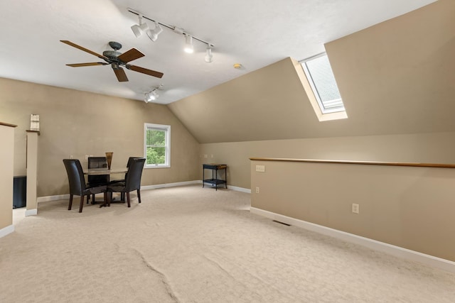 223 Atlantic Ave, North Hampton, NH 03862 - home office featuring rail lighting, carpet flooring, a ceiling fan, a skylight, and vaulted ceiling