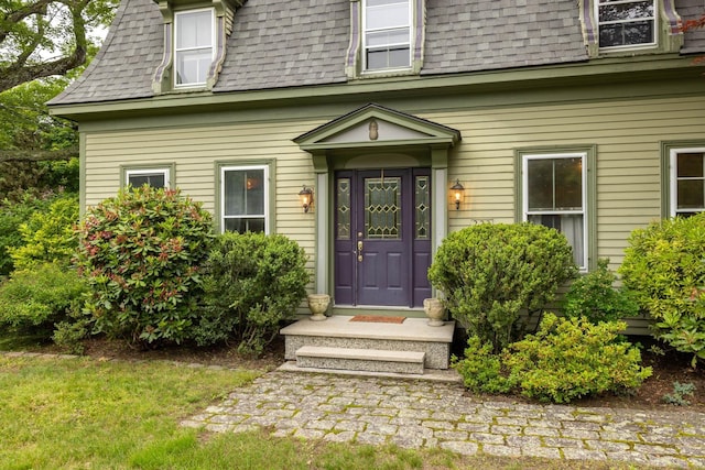 223 Atlantic Ave, North Hampton, NH 03862 - view of exterior entry featuring mansard roof and a shingled roof
