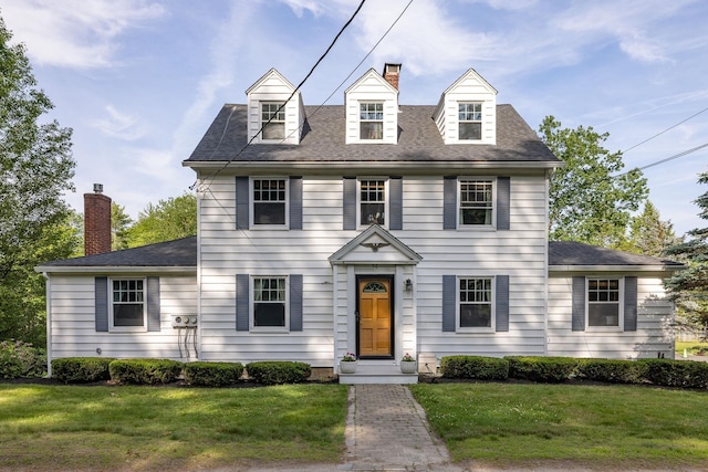 96 Madbury Rd, Durham, NH 03824 - view of front facade with a chimney, a front yard, and a shingled roof