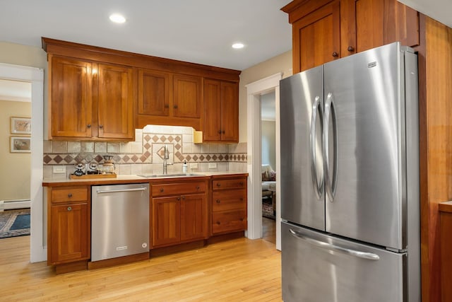 96 Madbury Rd, Durham, NH 03824 - kitchen with appliances with stainless steel finishes, baseboard heating, light wood-style floors, light countertops, and recessed lighting