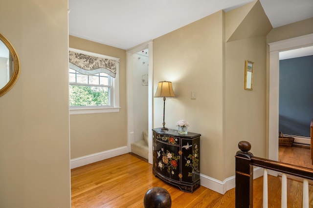 96 Madbury Rd, Durham, NH 03824 - hall featuring wood finished floors and a baseboard heating unit