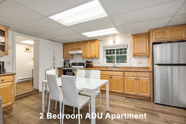 96 Madbury Rd, Durham, NH 03824 - kitchen featuring freestanding refrigerator, electric range, under cabinet range hood, a paneled ceiling, and a baseboard heating unit