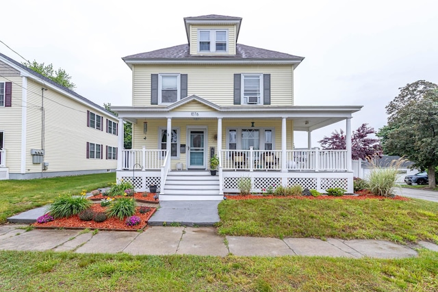 1076 Merrill St, Manchester, NH 03103 - view of front of house featuring covered porch and a front lawn