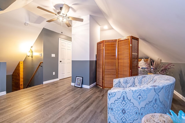 1076 Merrill St, Manchester, NH 03103 - sitting room featuring an upstairs landing, vaulted ceiling, wood finished floors, and a ceiling fan