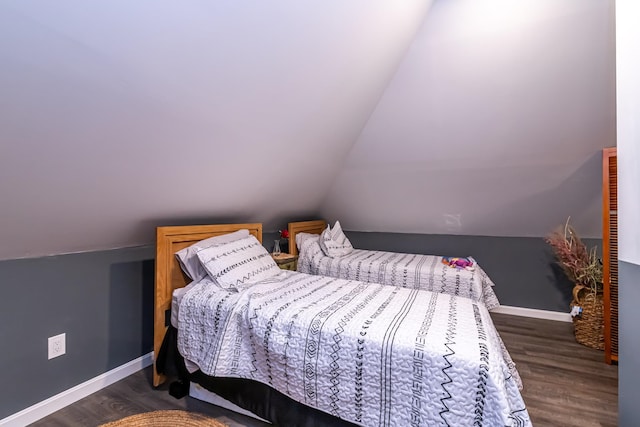 1076 Merrill St, Manchester, NH 03103 - bedroom featuring wood finished floors and vaulted ceiling