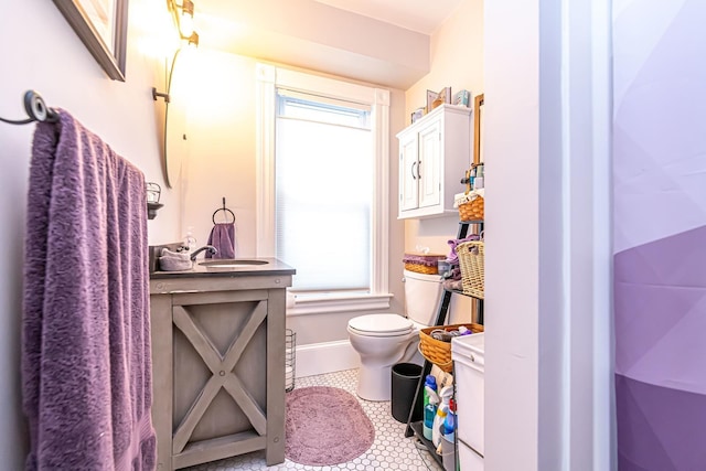 1076 Merrill St, Manchester, NH 03103 - bathroom with vanity and tile patterned floors