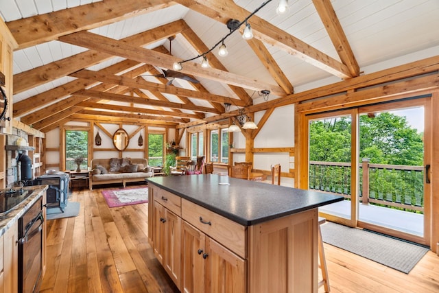 2208-2432 Backway Rd, Corinth, VT 05039 - kitchen featuring dark countertops, a wood stove, open floor plan, light wood-type flooring, and oven