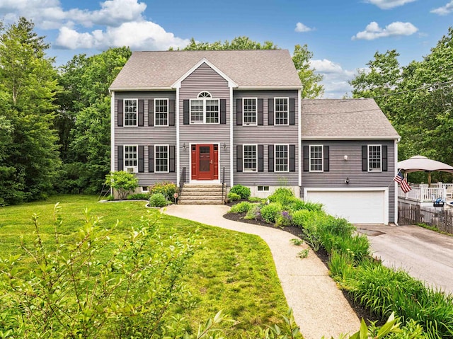 203 Blackwater Rd, Somersworth, NH 03878 - colonial inspired home featuring driveway, a garage, and roof with shingles