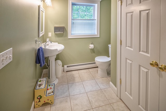 203 Blackwater Rd, Somersworth, NH 03878 - half bath with a baseboard radiator and tile patterned floors