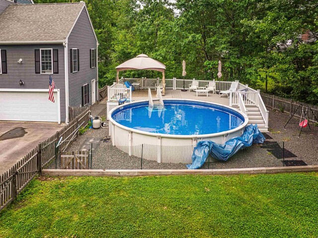 203 Blackwater Rd, Somersworth, NH 03878 - view of pool with a wooden deck, a fenced backyard, and a gazebo