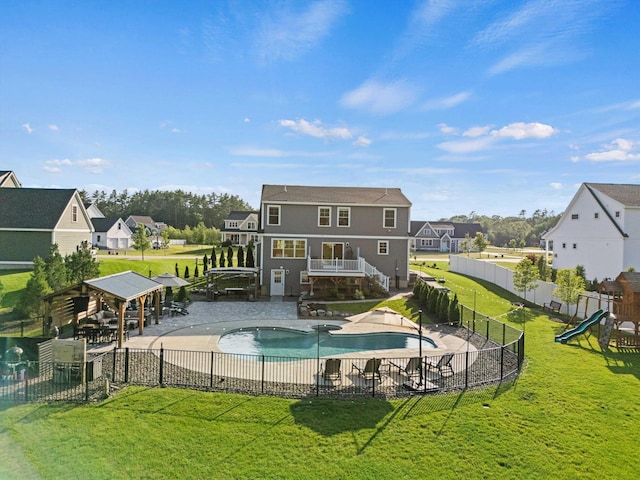 16 Daniels Dr, Lee, NH 03861 - back of property featuring a gazebo, a fenced backyard, a playground, a patio, and a residential view