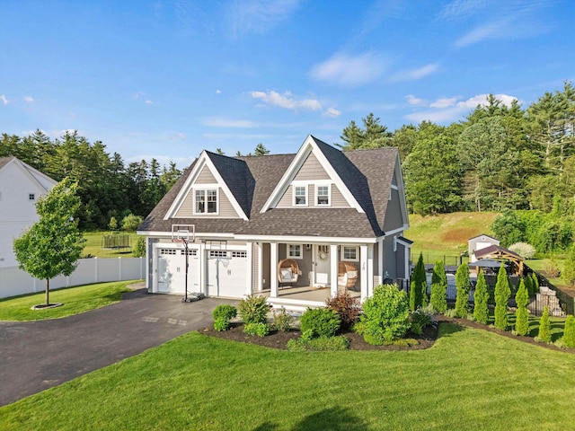 16 Daniels Dr, Lee, NH 03861 - shingle-style home featuring covered porch, driveway, and roof with shingles