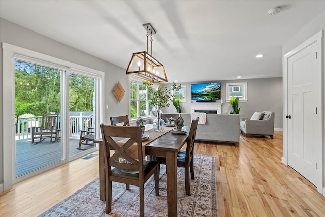 16 Daniels Dr, Lee, NH 03861 - dining area with light wood-style flooring, recessed lighting, and a chandelier