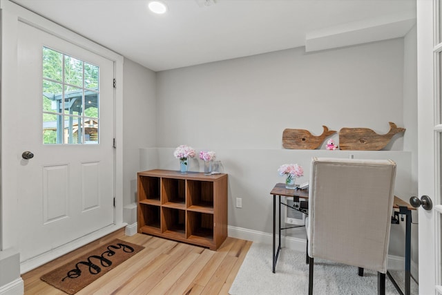 16 Daniels Dr, Lee, NH 03861 - doorway to outside featuring wood finished floors and baseboards