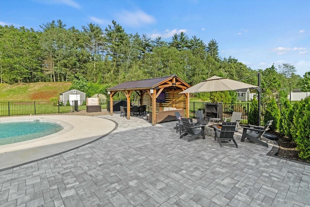 16 Daniels Dr, Lee, NH 03861 - view of pool featuring a patio, a gazebo, outdoor lounge area, and a storage shed