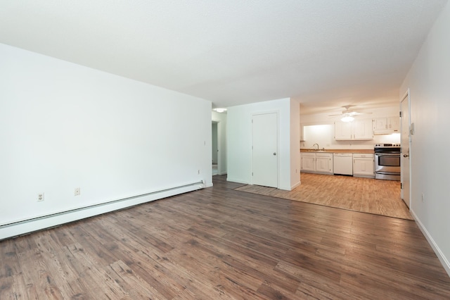 5 Autumn Leaf Dr Unit 24, Nashua, NH 03060 - unfurnished living room with wood finished floors, a baseboard heating unit, and ceiling fan