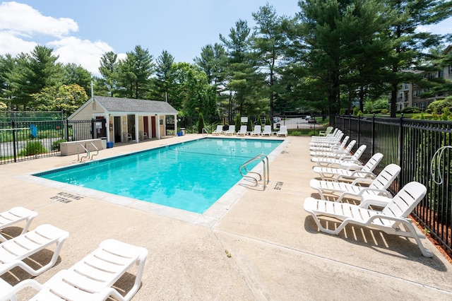 5 Autumn Leaf Dr Unit 24, Nashua, NH 03060 - community pool featuring a patio and view of wooded area