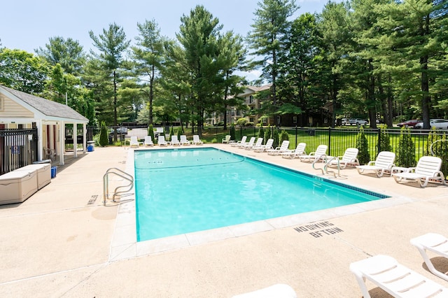 5 Autumn Leaf Dr Unit 24, Nashua, NH 03060 - community pool featuring a patio and view of wooded area