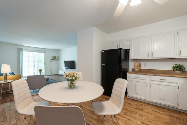 5 Autumn Leaf Dr Unit 24, Nashua, NH 03060 - dining space with light wood-style floors, ceiling fan, and an AC wall unit