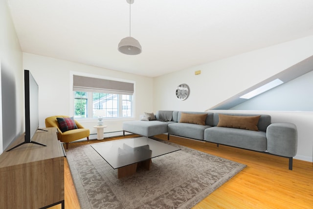 703 Springbrook Cir, Portsmouth, NH 03801 - living area with light wood-style flooring, a skylight, and baseboard heating