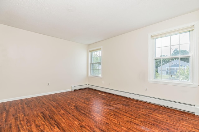 703 Springbrook Cir, Portsmouth, NH 03801 - empty room with dark wood-type flooring and baseboard heating