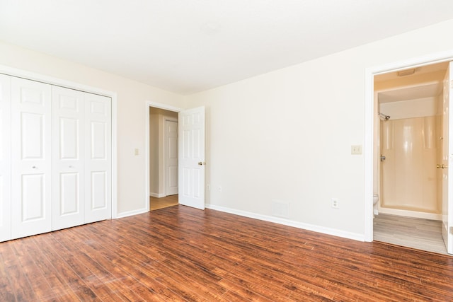 703 Springbrook Cir, Portsmouth, NH 03801 - unfurnished bedroom with wood finished floors and a closet
