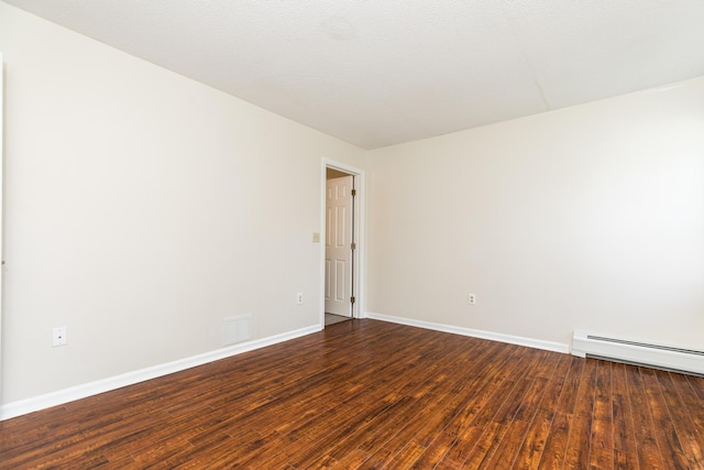 703 Springbrook Cir, Portsmouth, NH 03801 - unfurnished room featuring a baseboard radiator and dark wood-type flooring