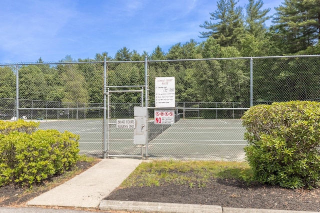 703 Springbrook Cir, Portsmouth, NH 03801 - view of tennis court featuring a gate