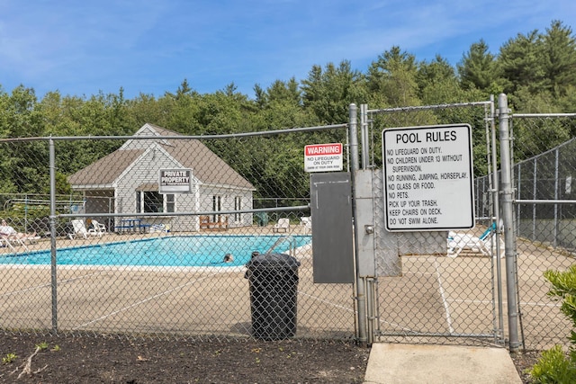 703 Springbrook Cir, Portsmouth, NH 03801 - community pool featuring a gate