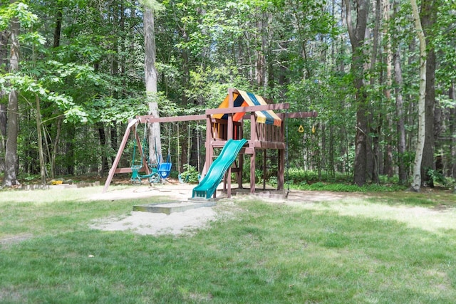 703 Springbrook Cir, Portsmouth, NH 03801 - view of play area featuring a lawn and a forest view
