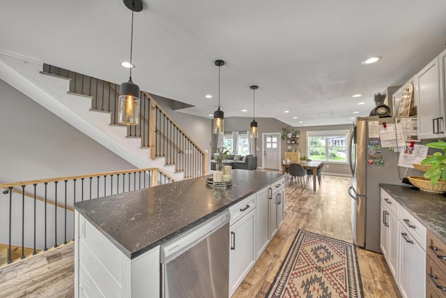 86 Chestnut St, Claremont, NH 03743 - kitchen featuring appliances with stainless steel finishes, recessed lighting, white cabinets, and light wood-style flooring