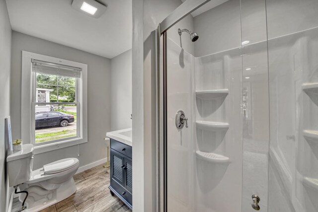 86 Chestnut St, Claremont, NH 03743 - full bath featuring a stall shower, wood finished floors, and vanity