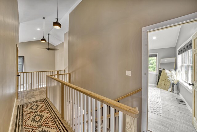 86 Chestnut St, Claremont, NH 03743 - corridor with wood finished floors, lofted ceiling, an upstairs landing, and recessed lighting