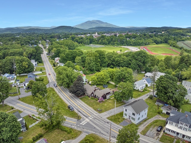 86 Chestnut St, Claremont, NH 03743 - aerial view of residential area featuring a mountain backdrop