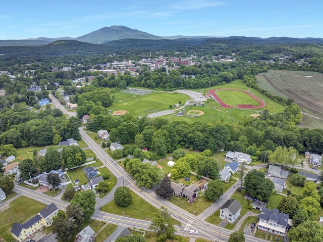 86 Chestnut St, Claremont, NH 03743 - aerial overview of property's location with a mountainous background and nearby suburban area