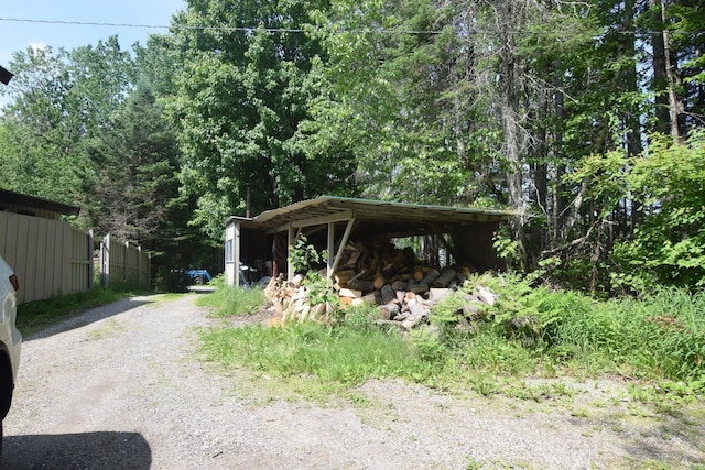 2054 Whitefield Rd, Bethlehem, NH 03574 - view of front of house with gravel driveway and an outdoor structure