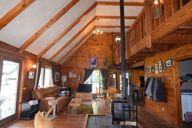 2054 Whitefield Rd, Bethlehem, NH 03574 - living area with wooden walls, high vaulted ceiling, beam ceiling, and wood finished floors