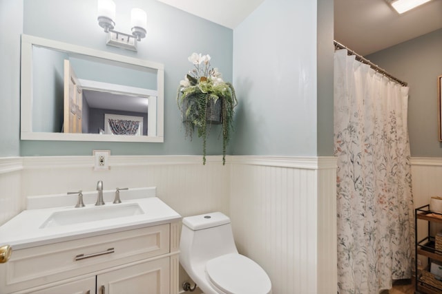 153 May St, Canaan, NH 03741 - bathroom with a wainscoted wall, vanity, and curtained shower