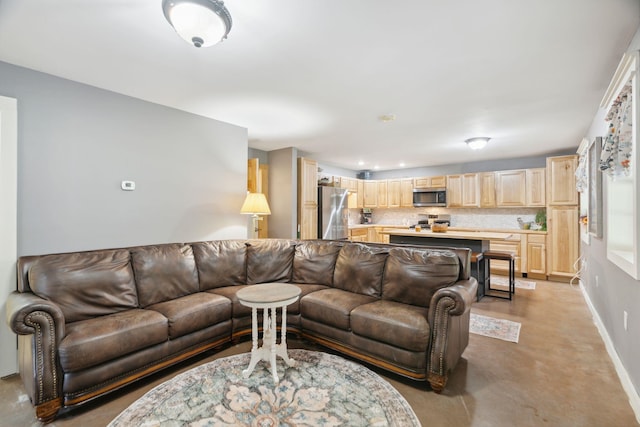 153 May St, Canaan, NH 03741 - living area with baseboards and concrete flooring