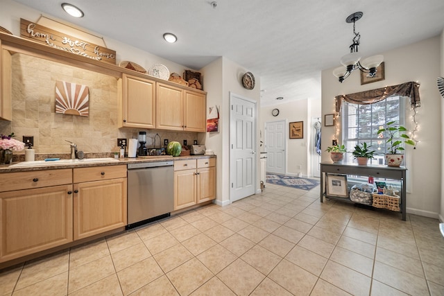 34 Mammoth Rd Unit 1, Hooksett, NH 03106 - kitchen featuring stainless steel dishwasher, light brown cabinets, tasteful backsplash, light tile patterned floors, and hanging light fixtures