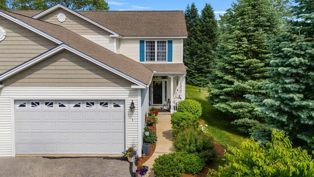 34 Mammoth Rd Unit 1, Hooksett, NH 03106 - traditional home featuring driveway and roof with shingles